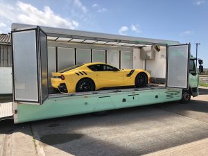 Supercar transport of yellow Ferrari.